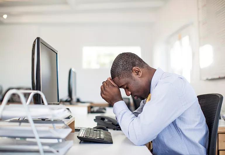 man stressed at work jpg