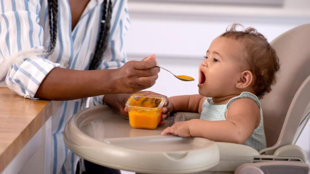 feeding baby food 1344065752