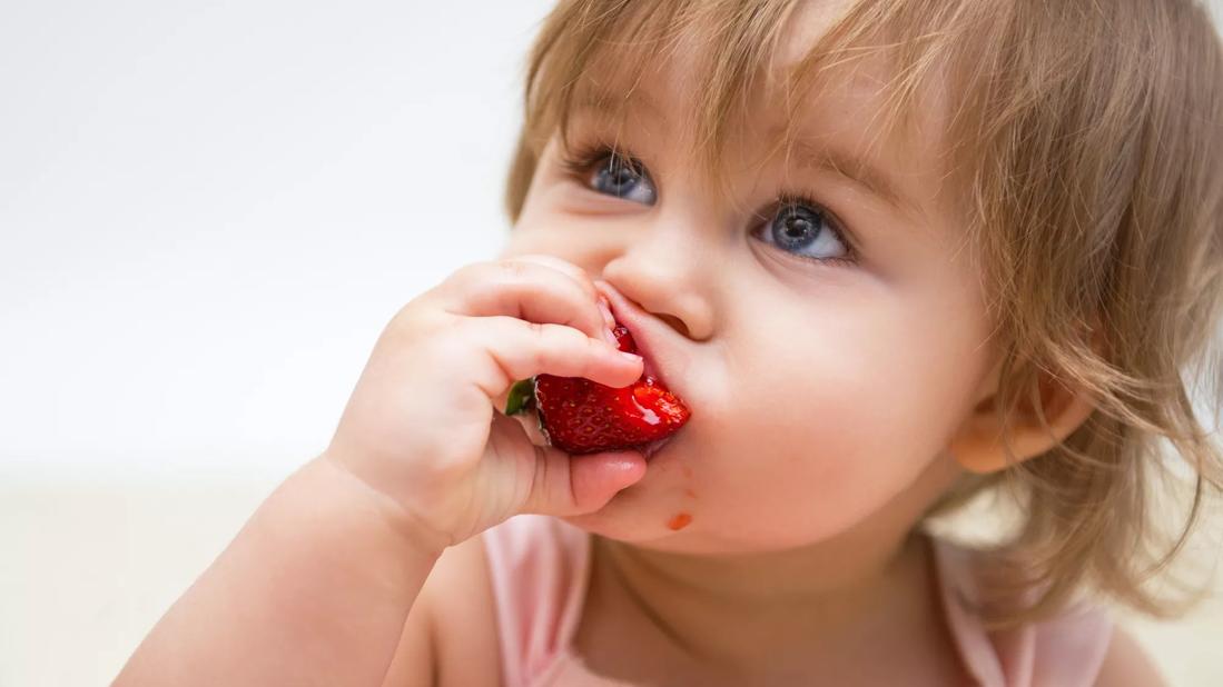 BabyEatingStrawberry jpg